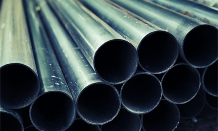 Stack of steel pipes in industrial